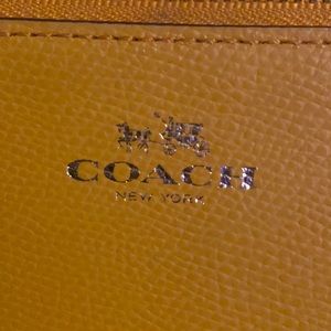 Orange coach coin purse